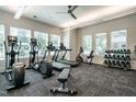 Spacious fitness center with treadmills, elliptical machines, stationary bikes, and weight rack at 1636 Raven Falls Dr, Wendell, NC 27591