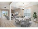 Bright living room featuring an open floor plan with modern lighting, a fireplace, and stylish décor at 2120 Castle Pines Dr, Raleigh, NC 27604