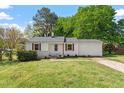 Charming single-story home featuring well-maintained lawn and landscape at 2304 Nelson St, Raleigh, NC 27610