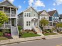 Inviting street view showcasing diverse home styles, each with a unique color palette and charming curb appeal at 282 Granite Mill Blvd, Chapel Hill, NC 27516