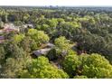 Beautiful aerial view showcasing the home's location within a lush green landscape and distant skyline at 3014 Hope Valley Rd, Durham, NC 27707
