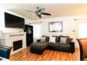 Cozy living room with a fireplace, a ceiling fan and a comfortable couch at 3336 Tarleton W, Durham, NC 27713