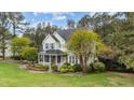 Beautifully landscaped two-story home with lush greenery surrounding the property at 402 Green Turret Dr, Rolesville, NC 27571