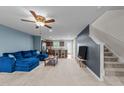 Open-concept living room shows a modern design, blending seamlessly into the kitchen and staircase at 4524 Flat Bastion Drive Dr, Raleigh, NC 27610