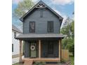 Charming two-story home with a welcoming front porch, natural wood columns, and tasteful landscaping at 612 E Ellerbee St, Durham, NC 27704