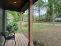 Inviting front porch with natural wood columns and views of the surrounding neighborhood at 612 E Ellerbee St, Durham, NC 27704