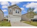 Beautiful two-story home featuring a two-car garage and neutral-colored siding in a Gathering-friendly neighborhood at 82 White Ash Dr, Clayton, NC 27527
