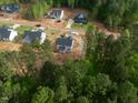 A new construction property in a scenic neighborhood surrounded by lush trees and greenery at 85 Purslane Dr, Franklinton, NC 27525