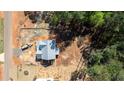 Aerial view of a two-story home under construction showing the surrounding treed lot and neighborhood at 85 Purslane Dr, Franklinton, NC 27525