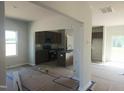 Modern kitchen features gray cabinets, stainless steel appliances, and a kitchen island at 89 Grove Township Way, Angier, NC 27501
