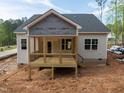 Newly constructed home featuring a cozy back porch, perfect for outdoor relaxation and entertaining at 90 Purslane Dr, Franklinton, NC 27525