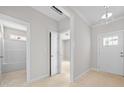 Bright entryway showcasing open doorways to bathroom, bedroom and front door at 90 Purslane Dr, Franklinton, NC 27525