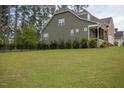 This beautiful backyard features a well-maintained lawn and nice view at 171 School Side Dr, Spring Lake, NC 28390