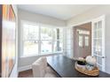 Bright office space featuring a large window and glass paneled french doors at 205 Riverine Dr, Pittsboro, NC 27312