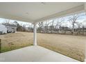 Expansive backyard with covered patio, perfect for outdoor entertaining at 21 Artesa Ct, Fuquay Varina, NC 27526