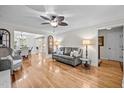 Open-concept living room with hardwood floors, ceiling fan, and neutral decor at 2259 Helena Moriah Rd, Timberlake, NC 27583