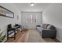 Cozy living room includes a comfortable couch, a rocking chair, and a well-lit window at 252 Tyree Trl, Burlington, NC 27215