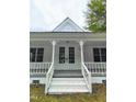 Close-up of the home's entry way with bright white trim and double doors leading into the home at 305 N Webb St, Selma, NC 27576