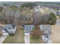 Aerial view of a neighborhood with mature trees and well-maintained homes at 416 Collinsworth Dr, Clayton, NC 27527