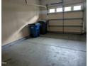 Spacious single-car garage with ample room for parking and storage, featuring a functional overhead door at 4502 Pale Moss Dr. Dr, Raleigh, NC 27606