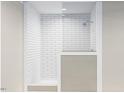 Modern bathroom with white subway tile and a walk-in shower at 6648 Woodlawn Dr, Oxford, NC 27565