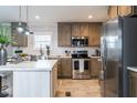 Charming kitchen with stainless steel appliances and breakfast bar at 6648 Woodlawn Dr, Oxford, NC 27565