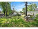 Spacious backyard with a patio set, great for enjoying outdoor meals and entertaining at 726 Elizabeth Ave, Wake Forest, NC 27587