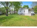 Expansive backyard with lush green grass, perfect for outdoor activities and relaxation at 726 Elizabeth Ave, Wake Forest, NC 27587
