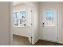 Bright entryway featuring a decorative glass front door, transom window, and sidelights allowing natural light to fill the space at 816 Canis Minor Rd, Wendell, NC 27591