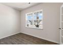 Office with hardwood flooring, a large window, and neutral walls for a clean and bright workspace at 816 Canis Minor Rd, Wendell, NC 27591