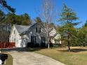 Inviting two-story home with a long driveway and attached garage at 20 Willows Den Ct, Youngsville, NC 27596