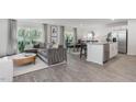 Open-concept living area featuring hardwood floors, large windows, and lots of natural light at 2145 Monk Dr, Haw River, NC 27258