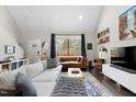 Light-filled living room with high ceilings and views to the home's exterior at 218 Archdale Dr, Durham, NC 27707