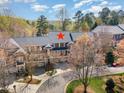 Aerial view of townhomes with lush surrounding greenery and mature trees at 222 Lions Gate Dr, Cary, NC 27518
