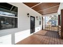 Inviting front porch with a dark wood ceiling and porch, offering a welcoming entrance to the home at 2517 Newbold St, Raleigh, NC 27603