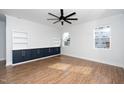 Spacious living room with built-in shelving and cabinets, offering ample storage and a clean, modern aesthetic at 2517 Newbold St, Raleigh, NC 27603