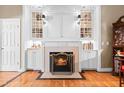 Elegant fireplace with custom built-ins, adding warmth and character to this inviting living space at 255 Williamston Ridge Dr, Youngsville, NC 27596