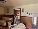 Cozy living room with wood paneling and comfortable seating at 3413 Renee Dr, Sanford, NC 27332