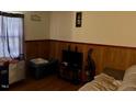 Living room with wood paneling, a TV, and a window at 3413 Renee Dr, Sanford, NC 27332