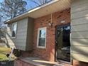Close up of the home's front entry showing the brick and siding details at 3414 Renee Dr, Sanford, NC 27332
