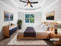 This bedroom features a ceiling fan, large window, and modern decor for a relaxing atmosphere at 3638 Pine Needles Dr, Wake Forest, NC 27587