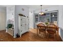 Charming dining area with a wooden table set, built-in shelving, and stylish decor at 3805 Chimney Ridge Pl # 003, Durham, NC 27713