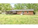 Brick home with a spacious backyard and a covered porch for outdoor entertaining at 428 Mitchell Ave, Franklinton, NC 27525