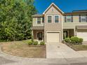Inviting townhome with a one-car garage and manicured landscaping at 4901 Rose Quartz Way, Raleigh, NC 27610