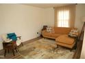 Inviting living room with a plush couch, hardwood floors, and decorative throw pillows at 513 Orange St, Oxford, NC 27565