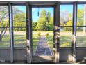 View from the front porch, showcasing the landscaped yard and quiet street at 919 E Main St, Haw River, NC 27258