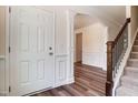Elegant foyer featuring hardwood floors, white wainscoting, and a staircase with wooden banister at 0 Sawmill, Cedar Grove, NC 27231