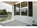 Cozy front porch with classic white railings, offering a welcoming outdoor space at 0 Sawmill, Cedar Grove, NC 27231