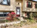 A welcoming front entrance is surrounded by a vibrant garden at 103 Wesker Cir, Durham, NC 27703