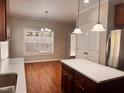 Kitchen with center island, stainless appliances, and eat-in area by the window at 104 Mainline Sta, Morrisville, NC 27560